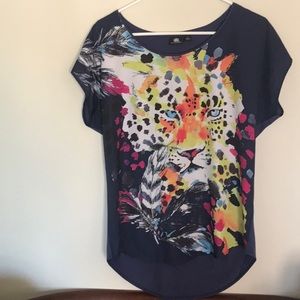 Size Small, fits like a medium. Face of a tiger!